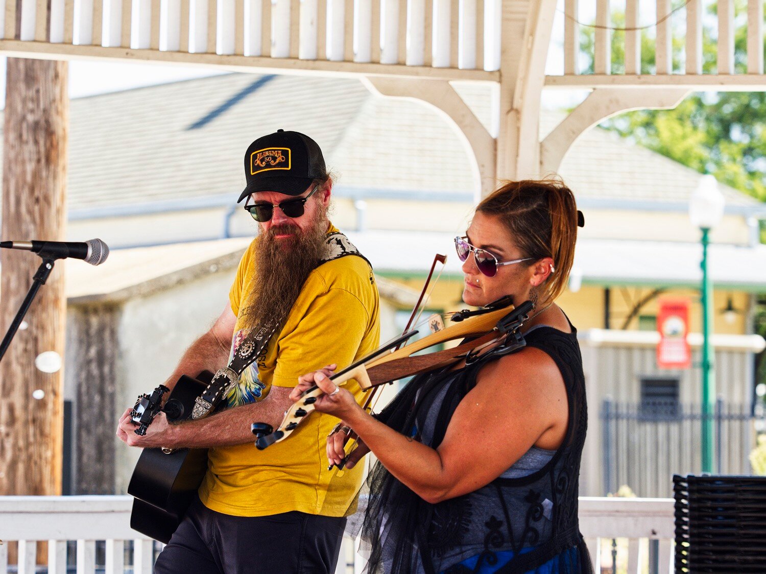 Lee Mathis and Sheila Weaver provide excellent musical entertainment under the gazebo on Commerce St. [additional iron horse images available]